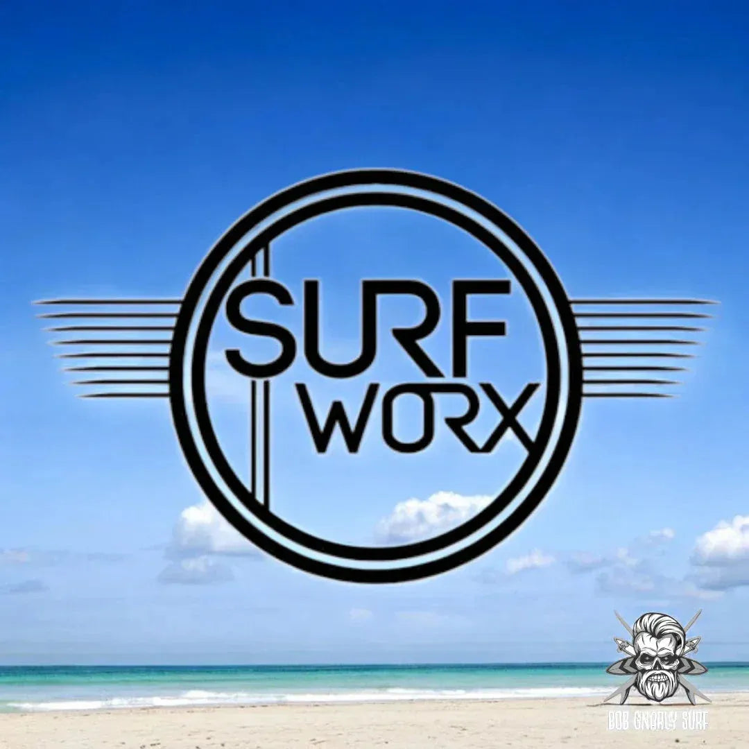 Surf Worx black logo with circle and lines over a bright blue sky and calm beach scene