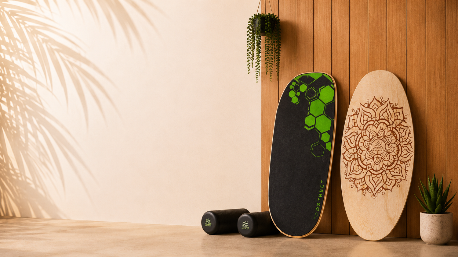 Wooden balance board with intricate mandala design on black roller on concrete floor against wooden wall
