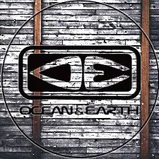 Ocean Earth logo with stylized OE letters on a weathered wooden plank background